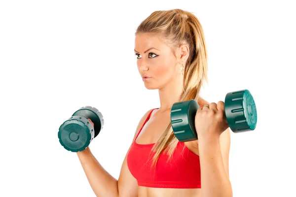 Kvinnan gör gym med vikter Stockbild