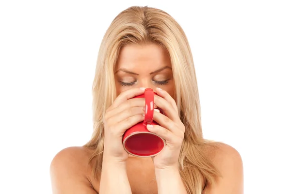 Beautiful young woman drinking coffee or tea — Stock Photo, Image