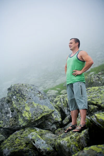 Young man in mountains — Stock Photo, Image