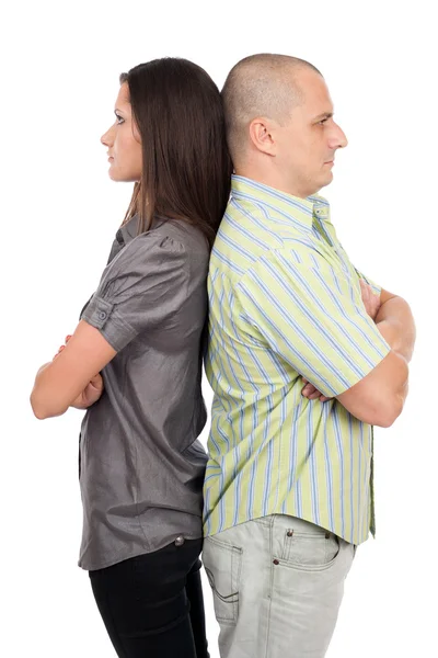 Couple standing back to back Stock Picture