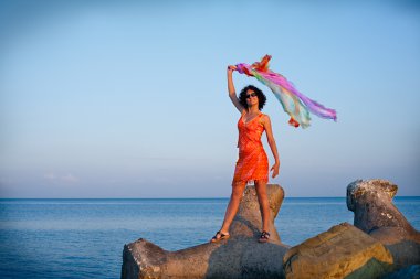 Happy young woman at the sea clipart