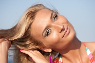 Closeup of a beautiful blonde at sea