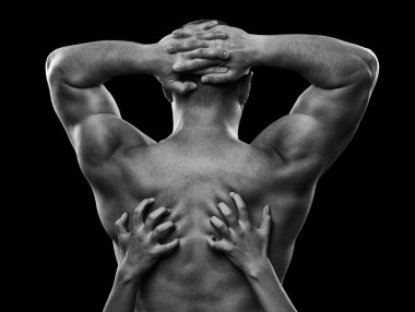 Monochrome image of a man's back and woman's hands clipart