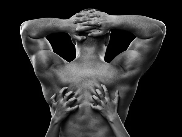 Monokrom bild av en mans rygg och kvinnans händer — Stockfoto