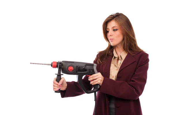 Imagem de conceito de uma mulher de negócios com máquina de perfuração — Fotografia de Stock