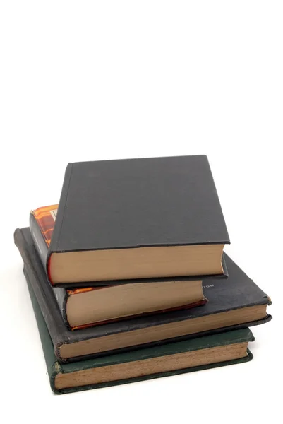 Pilha de livros sobre fundo branco — Fotografia de Stock