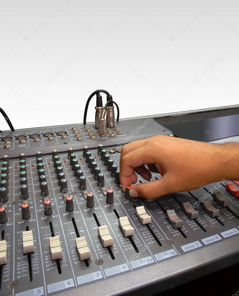 Sound mixer console and hand on white