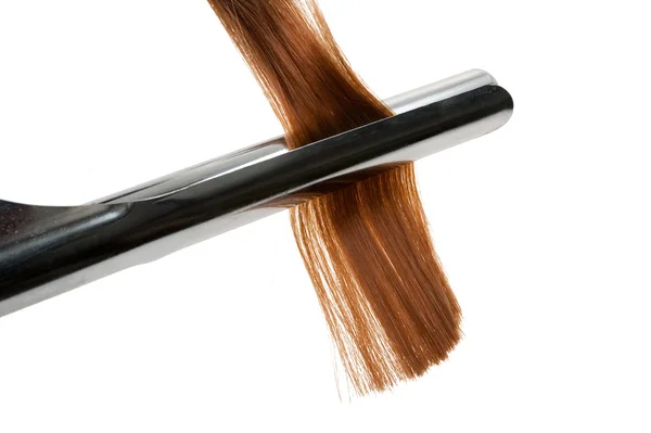 Кёрлинг волос с кёрлингом утюг — стоковое фото