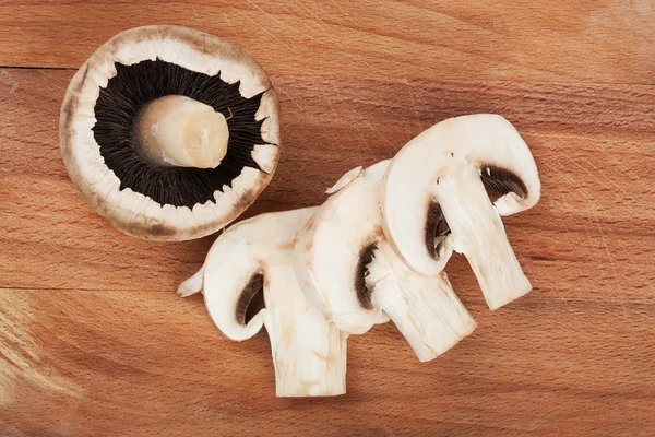 Fresh mushrooms on wooden table — Stock Photo, Image