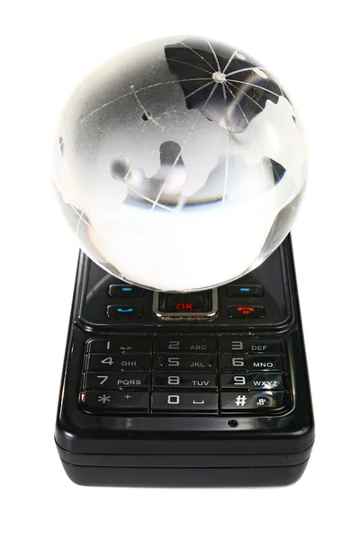 Glas globe op een mobiele telefoon — Stockfoto