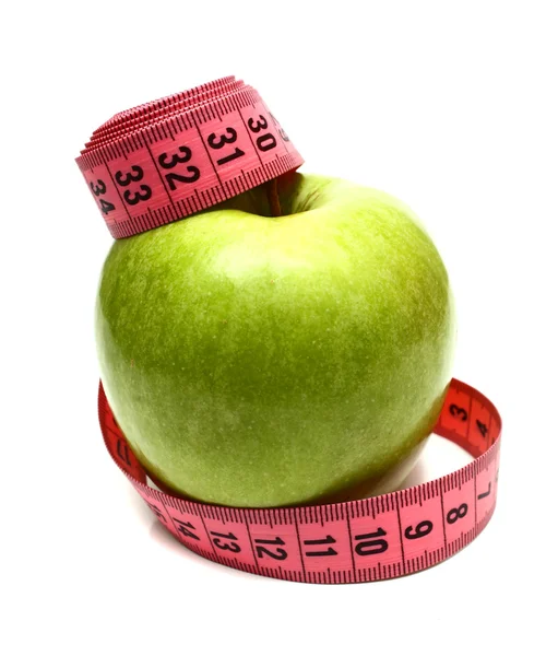 Zelené jablko a měřicí pásky pro dietu — Stock fotografie