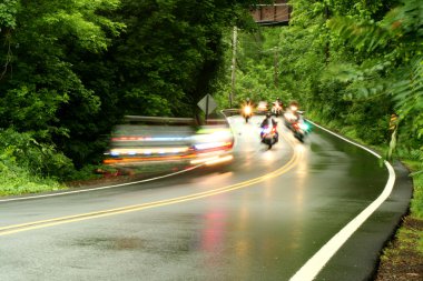 Police motorcycles speeding down a road clipart