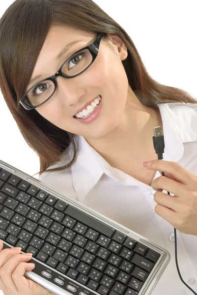 Businesswoman with computer keyboard — Stock Photo, Image