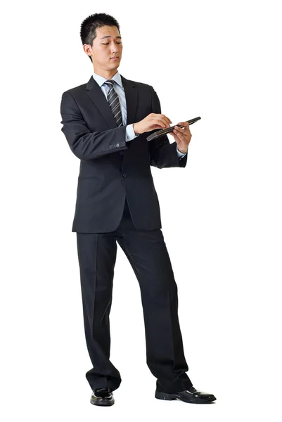 Young businessman with calculator — Stock Photo, Image