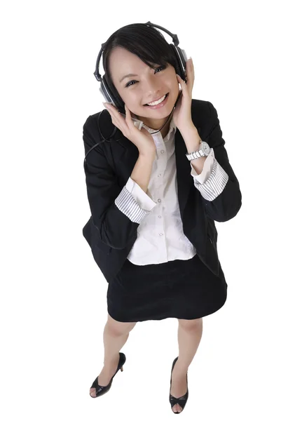 Happy smiling business woman listen music — Stock Photo, Image
