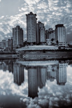 City scenic with building reflection clipart