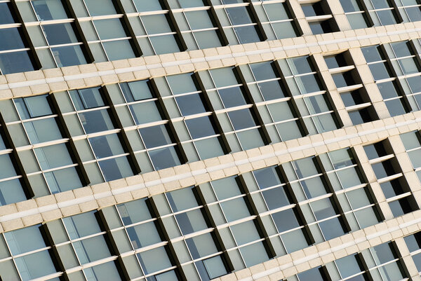 Abstract business background of office buildings wall and glass of windows.