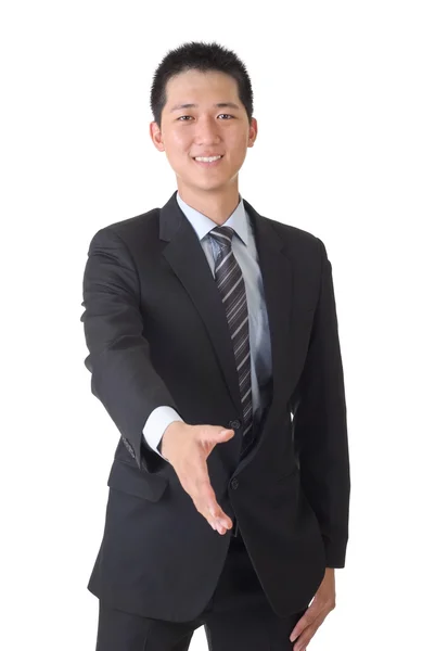 Азиатский бизнесмен пожимает руку — стоковое фото