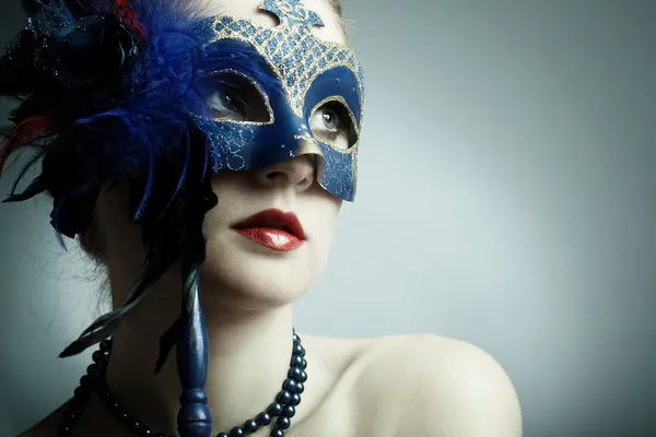 The beautiful young girl in a mask — Stock Photo, Image
