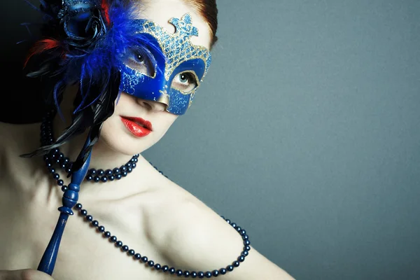 The beautiful young girl in a mask Royalty Free Stock Images