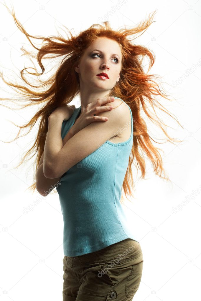 The young sexual woman with red hair