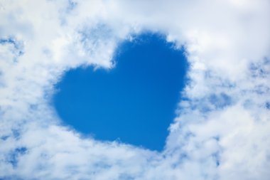 Heart from cloud in the blue sky clipart
