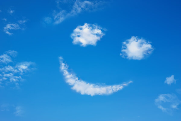 Smilie from cloud in the blue sky
