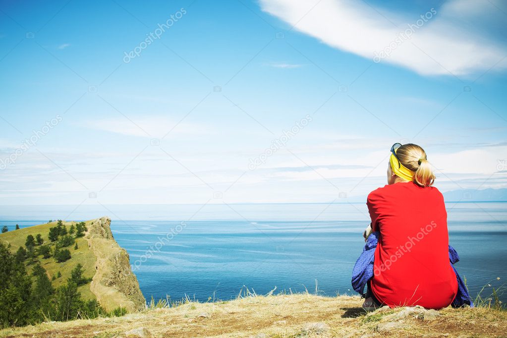 The woman looking at a beautiful landscape