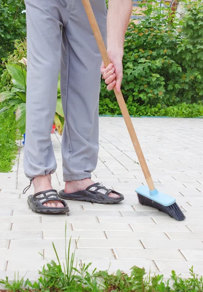 Men in sandals and brush — Stock Photo, Image