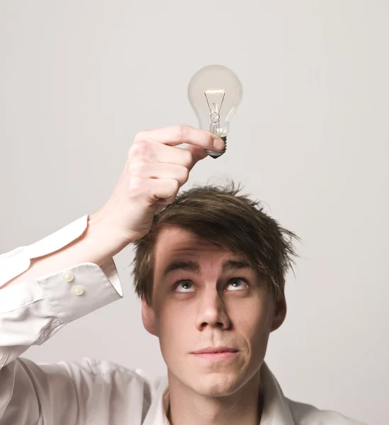 Man with light-bulb — Stock Photo, Image