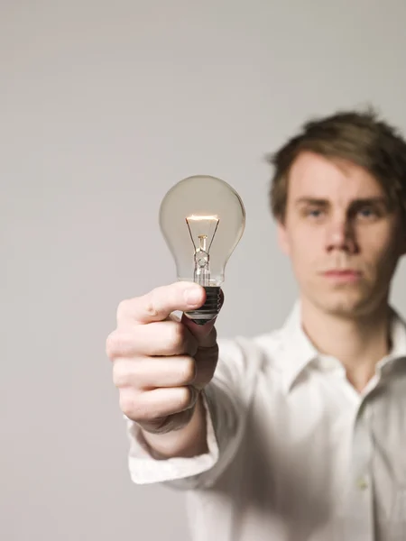 Man with light-bulb — Stock Photo, Image