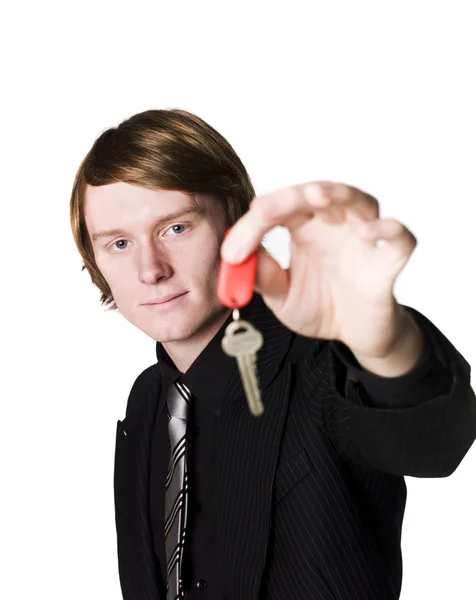 Homem segurando uma chave — Fotografia de Stock