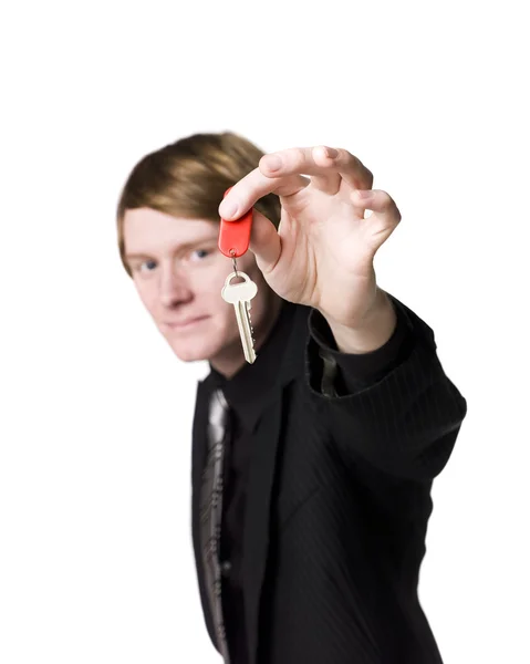 Hombre sosteniendo una llave —  Fotos de Stock