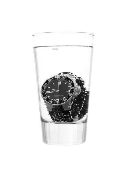 Glas e um relógio — Fotografia de Stock