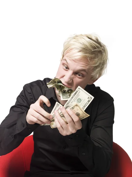 Mann isst Geld — Stockfoto