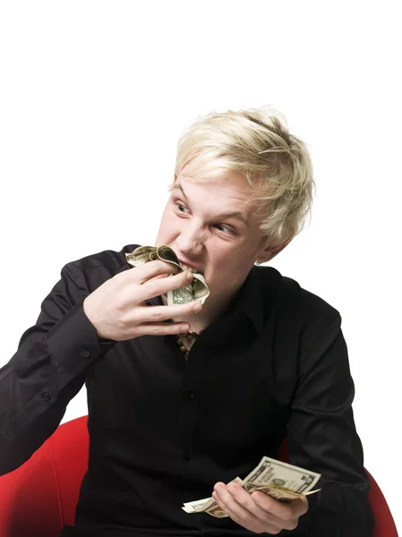 Mannen äter pengar — Stockfoto