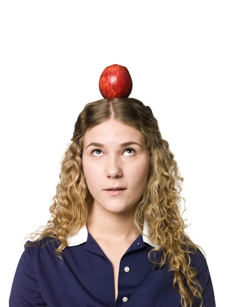 Girl with an apple on her head — Stock Photo, Image