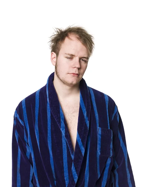 Tired man in a robe — Stock Photo, Image