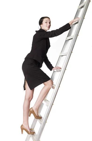 Woman climbing a ladder — Stock Photo, Image