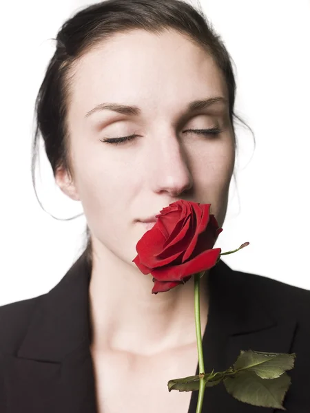 stock image Woman smell a rose