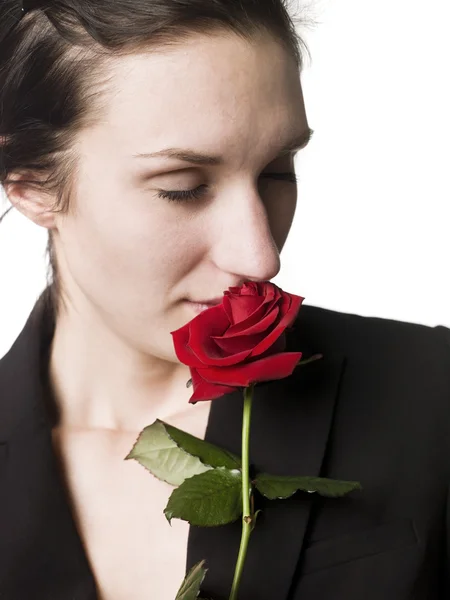 stock image Woman smell a rose