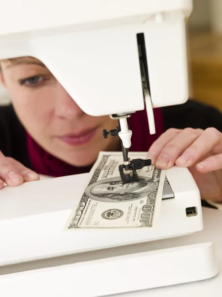 stock image Woman sewing money