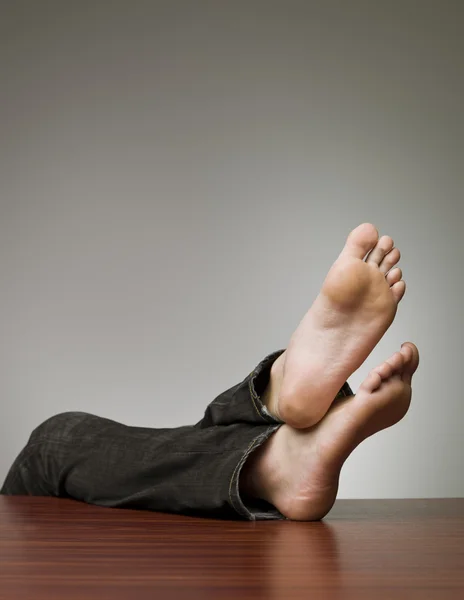 stock image Feet on the table