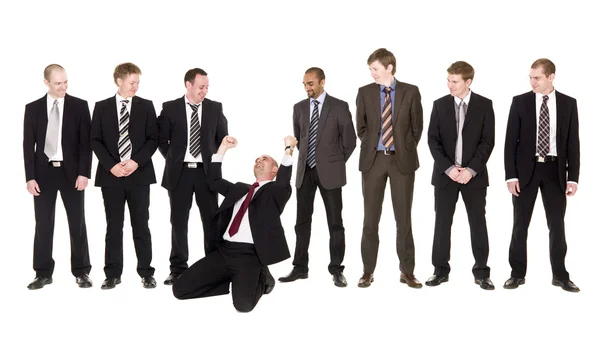 Happy man in front of his team — Stock Photo, Image