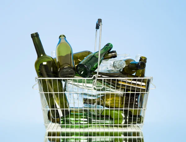 Glass bottles in a wastebasket — Stock Photo, Image
