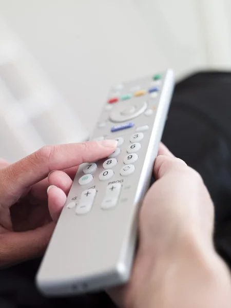Holding a Remote Control — Stock Photo, Image