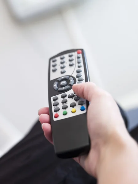 Holding a Remote Control — Stock Photo, Image
