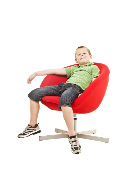 肘掛け椅子に若い男の子 — ストック写真