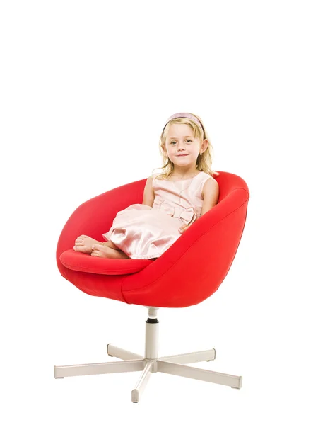 Young girl in an armchair — Stock Photo, Image