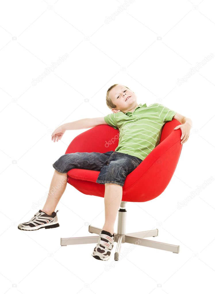 Young boy in armchair